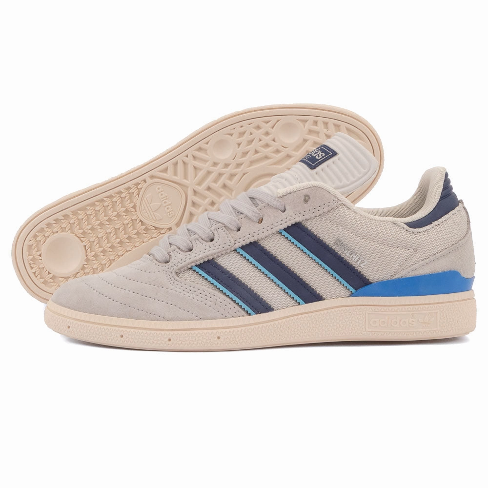 Adidas - Busenitz (Grey Two / Dark Blue / Chalk White) running in a lagoon area shoes