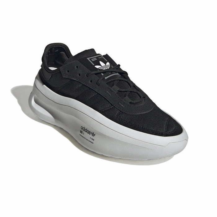 Adidas Men's Adifom TRXN Shoes - Black / White running on concrete