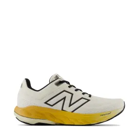 New Balance Men's Fresh Foam X 860v14 Sneaker in Sea Salt with Angora and Dried Apricot College Trend Leaf Path