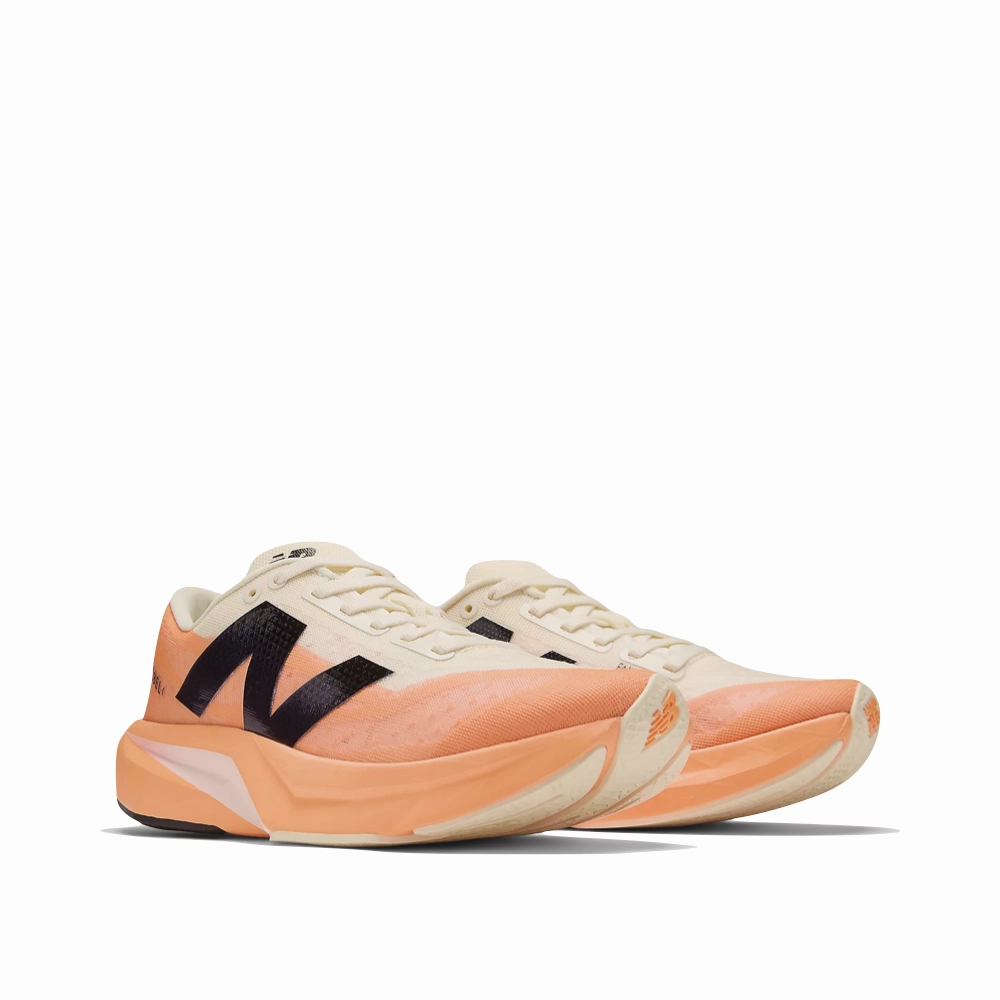 Wear Light New Balance Women's FuelCell Rebel v4 Sneaker in Hot Mango/Angora/Black