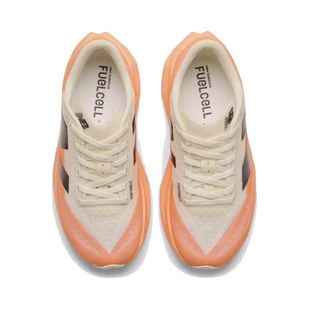 New Balance Women's FuelCell Rebel v4 Sneaker in Hot Mango/Angora/Black River Hike Marathon Day