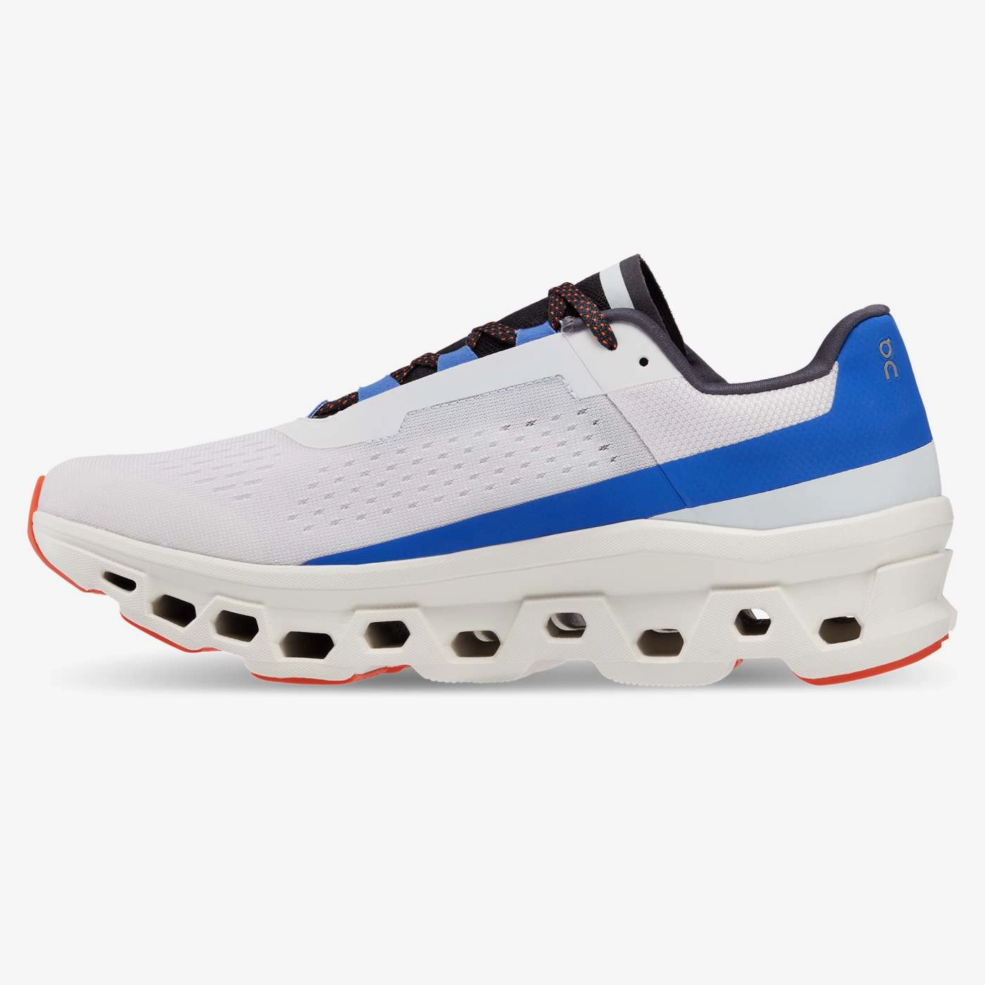 On Running Men's Cloudmonster Shoes - Frost / Cobalt running in a seagrass meadow area shoes