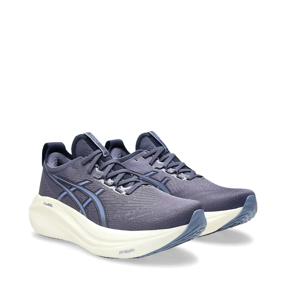 Skip Step Airflow Channeling Asics Men's Gel-Nimbus 27 Sneaker in Indigo Fog/Denim Blue