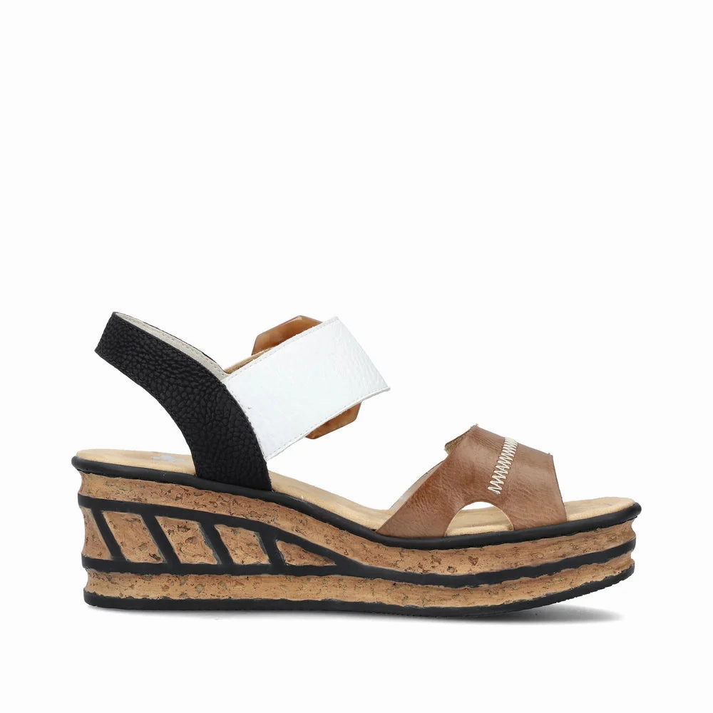 Wardrobe Staple Rieker Women's Rose 76 Buckle Strap Wedge Sandal in White/Brown